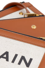 Carica l'immagine nel visualizzatore di Gallery, Clutch in canvas e pelle
